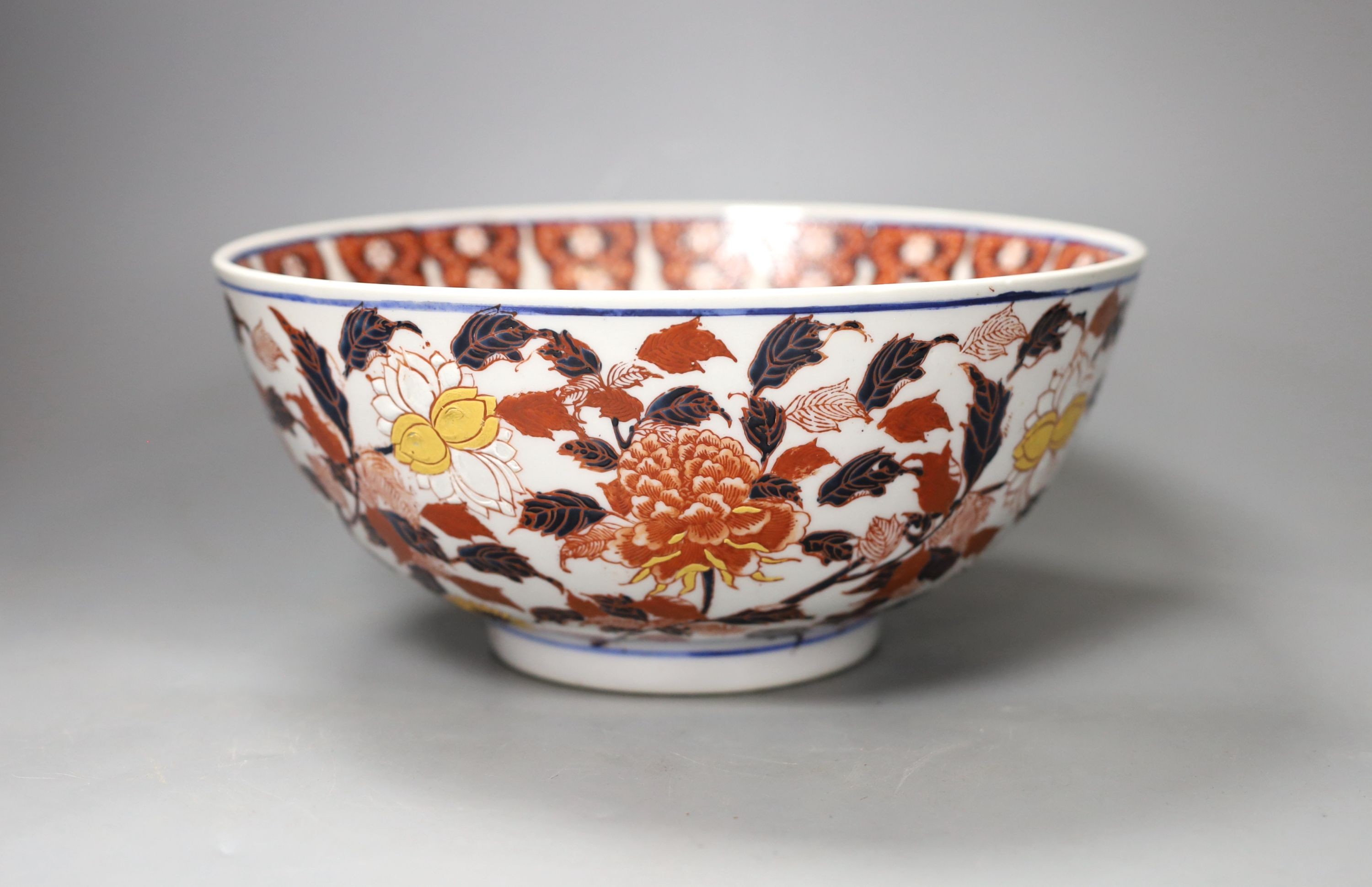 A Chinese porcelain fruit bowl, enamelled in Imari colours, 26cm. diam.